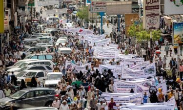 People gather for a demonstration demanding the end of a years-long siege imposed by Yemen's Houthi rebels in the city of Taiz