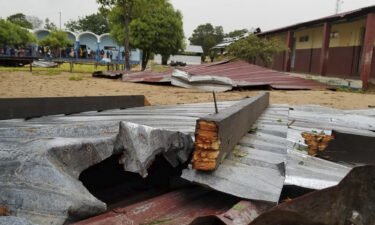The damaged roof of a school lies in the playground in Vilanculos