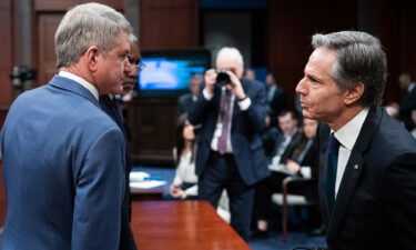 Chairman Michael McCaul (left) and ranking member Gregory Meeks speak with Secretary of State Antony Blinken (right) during a House Foreign Affairs Committee hearing on March 23.