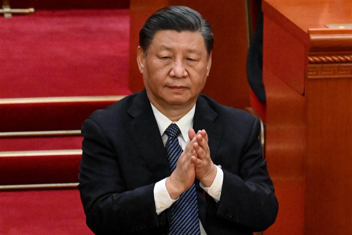<i>Noel Celis/AFP/Getty Images</i><br/>China's leader Xi Jinping applauds during the fifth plenary session of the National People's Congress (NPC) at the Great Hall of the People in Beijing on March 12.
