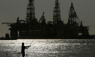 The Biden administration is auctioning off more than 73 million acres of waters in the Gulf of Mexico to offshore oil and gas drilling. Pictured is an oil drilling platform in Port Aransas