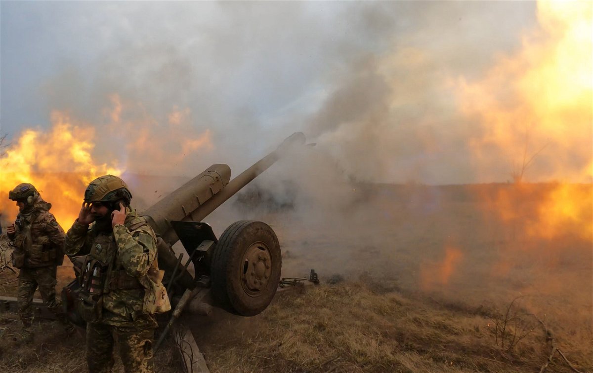 <i>Sergey Shestak/AFP/Getty Images</i><br/>Ukrainian troops fire a D-30 howitzer at Russian positions near Bakhmut