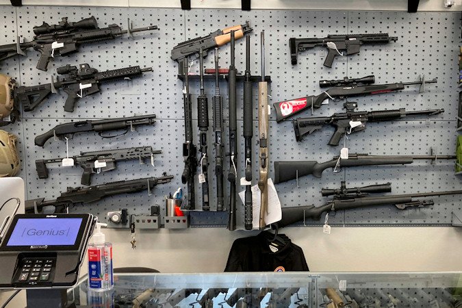 Firearms are displayed at a gun shop in Salem on Feb. 19, 2021