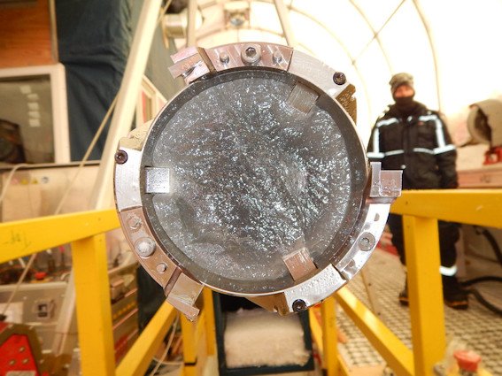 Close-up view of an ice core still in the drill barrel during a drilling project in Antarctica