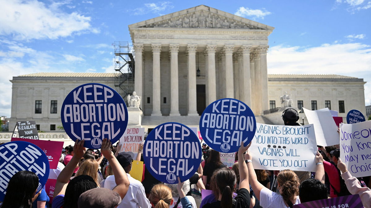 <i>Andrew Caballero-Reynolds/AFP/Getty Images</i><br/>Demonstrators rally in support of abortion rights at the Supreme Court in Washington