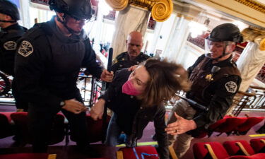 Law enforcement forcibly clear the Montana House of Representatives gallery during a protest after the Speaker of the House refused again to acknowledge Rep. Zooey Zephyr