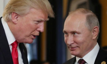 Donald Trump chats with Vladimir Putin in 2017.