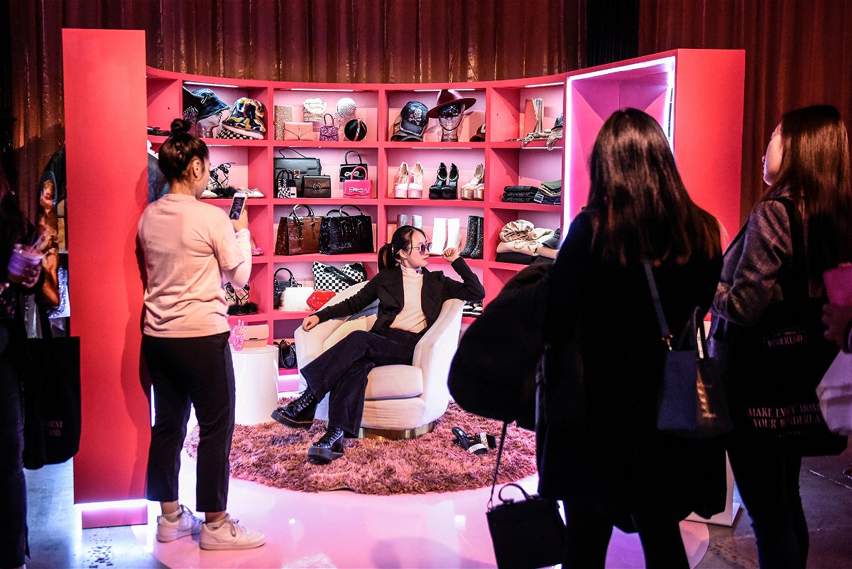 <i>Stephanie Keith/Bloomberg/Getty Images</i><br/>Shoppers taking photos at a Shein pop-up store in New York in October. Shein has seen its popularity soar in the United States as its trendy apparel wins over customers.