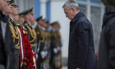 NATO Secretary General Jens Stoltenberg visits the Wall of Remembrance to pay tribute to fallen Ukrainian soldiers in Kyiv on April 20.