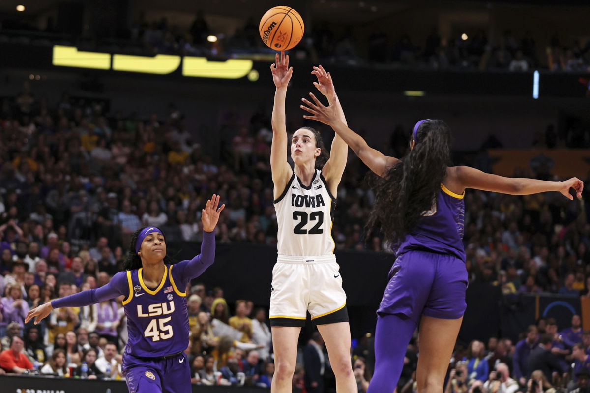 <i>Maddie Meyer/Getty Images</i><br/>Clark shoots the ball against Reese during the fourth quarter of the championship game.