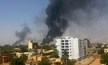 Smoke billows above residential buildings in Khartoum