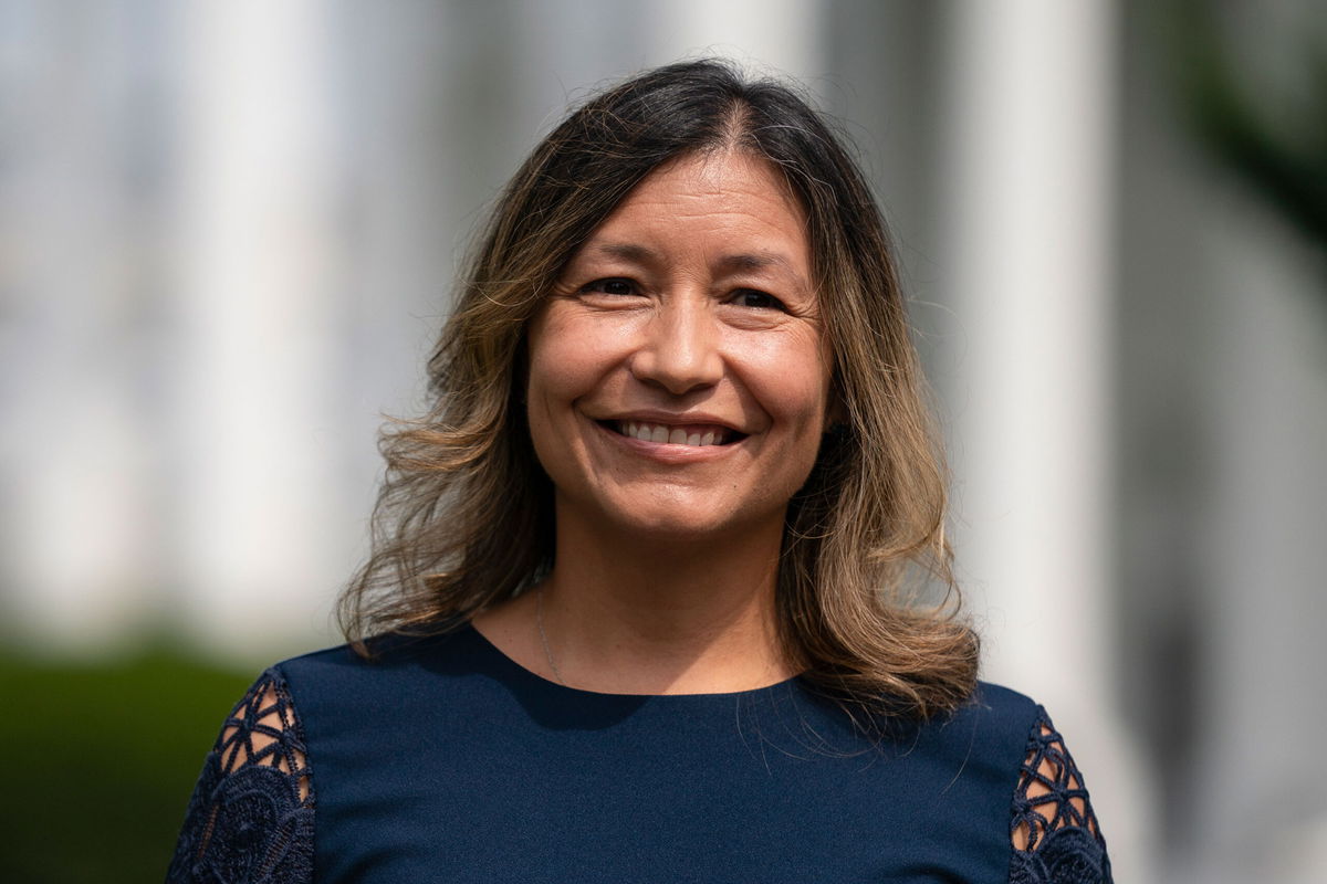 <i>Evan Vucci/AP</i><br/>Julie Chavez Rodriguez stands outside the White House on June 9