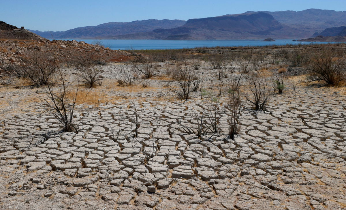 <i>Ethan Miller/Getty Images</i><br/>Lake Mead is seen in the distance in an area that used to be underwater near Boulder Beach on June 12