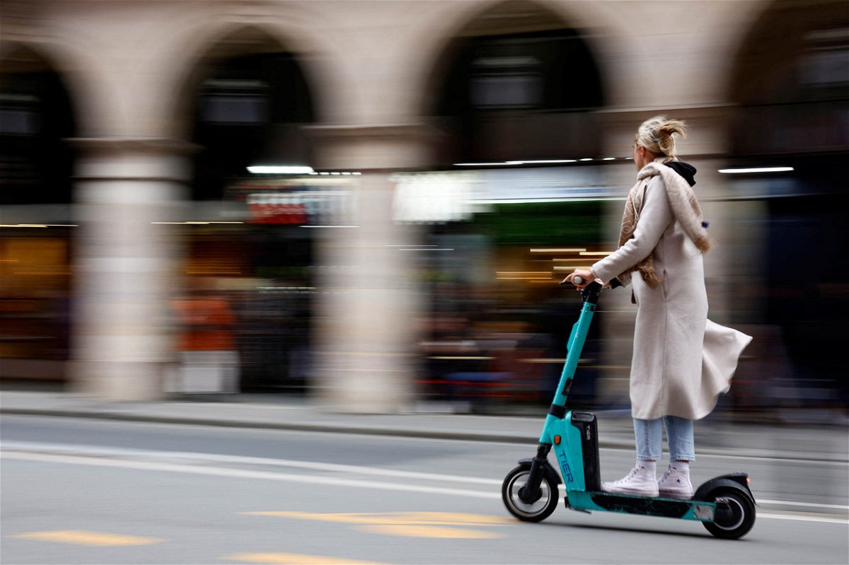 <i>Sarah Meyssonnier/Reuters</i><br/>A woman rides an electric scooter in Paris on on April 1. Residents of Paris have voted in favor of banning rental electric scooters from the French capital.