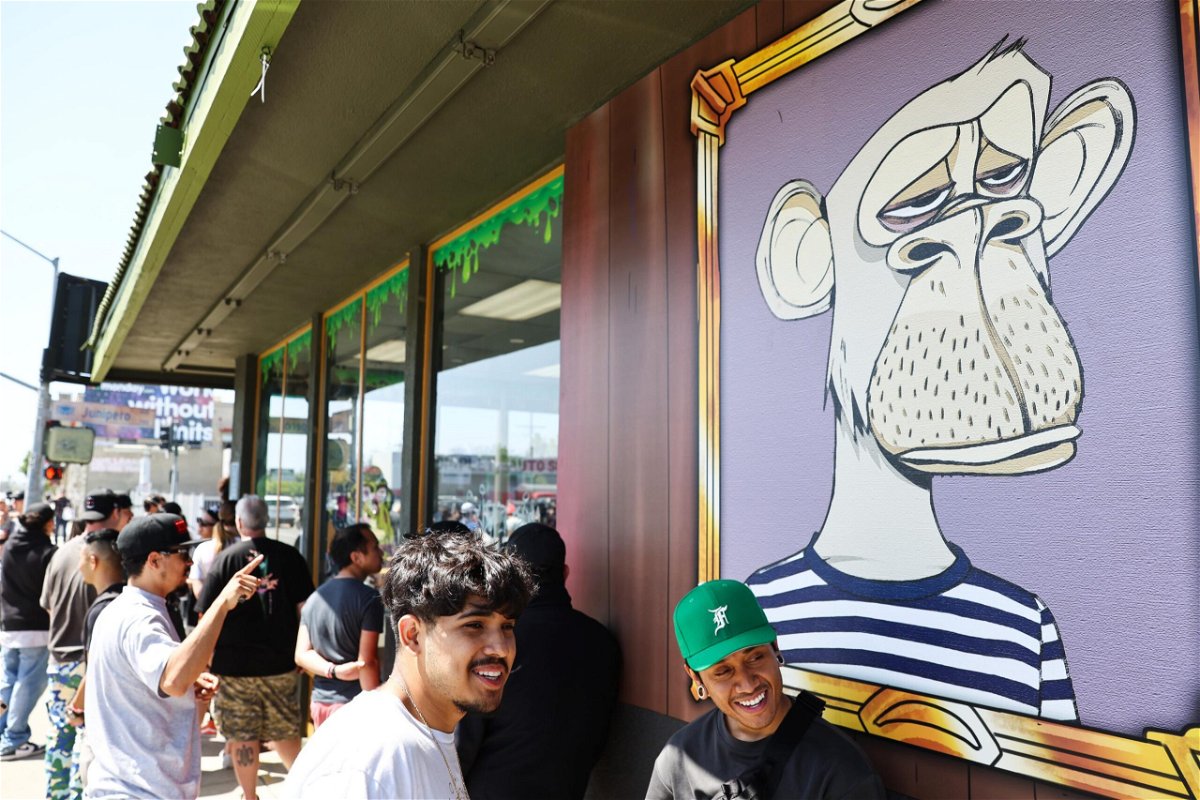 <i>Mario Tama/Getty Images</i><br/>People wait in line at the April 2022 grand opening of the Bored & Hungry pop-up burger restaurant in Long Beach
