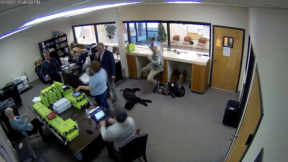 <i>Coffee County</i><br/>Newly obtained surveillance video shows a Republican county official and a team of operatives working for Trump 2020 attorney Sidney Powell inside a restricted area of the elections office in Coffee County Georgia. Portions of this image were obscured to protect the identity of people unnamed in the report.