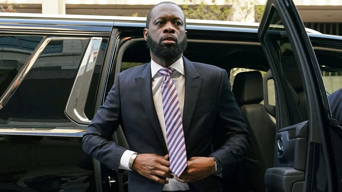 <i>Kevin Lamarque/Reuters</i><br/>Grammy award-winning Fugees rapper Pras Michel arrives for opening arguments in his trial at US District Court in Washington