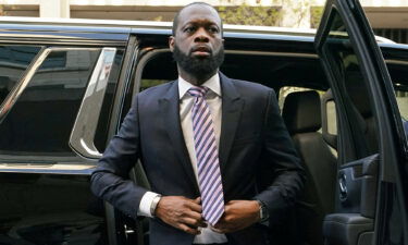 Grammy award-winning Fugees rapper Pras Michel arrives for opening arguments in his trial at US District Court in Washington