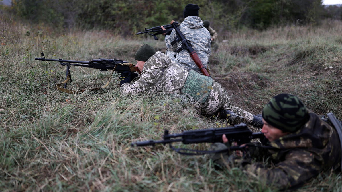 <i>AP</i><br/>Recruits hold their weapons during military training at a firing range in the Krasnodar region in southern Russia in October 2022.