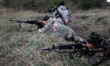 Recruits hold their weapons during military training at a firing range in the Krasnodar region in southern Russia in October 2022.