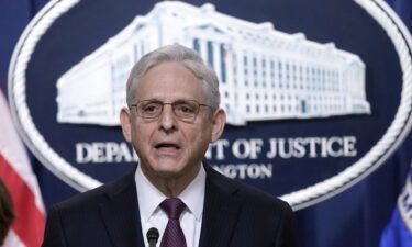 Attorney General Merrick Garland announced charges against more than two dozen defendants