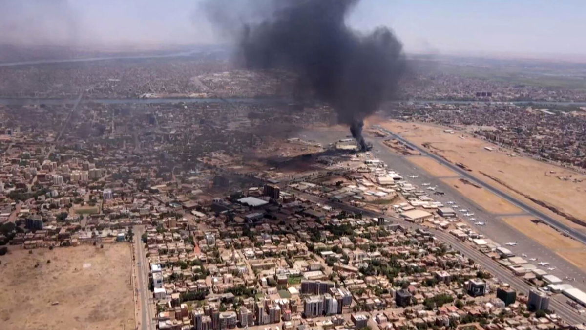 <i>AFP/Getty Images</i><br/>The US is deploying 'additional capabilities' near Sudan to assist with a potential embassy evacuation. This image shows an aerial view of black smoke rising above the Khartoum International Airport amid ongoing battles between the forces of two rival generals.