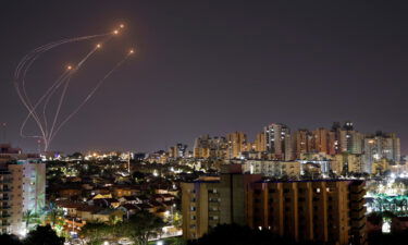 Streaks of light are seen as Israel's Iron Dome anti-missile system intercept rockets launched from the Gaza Strip