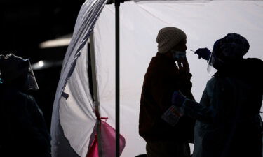 A man is tested for Covid-19 at a free testing site in downtown Washington