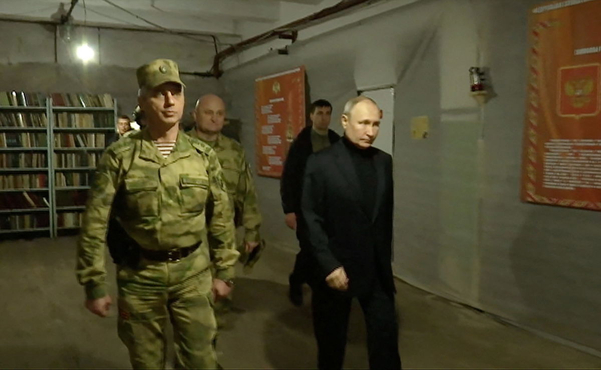 <i>Kremlin.ru/Reuters</i><br/>Putin visits the national guard headquarters in the occupied Luhansk region in eastern Ukraine.