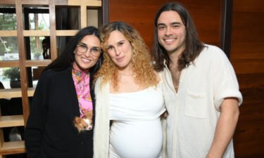 (L-R) Demi Moore is seen here with Rumer Willis and Derek Richard Thomas in March.