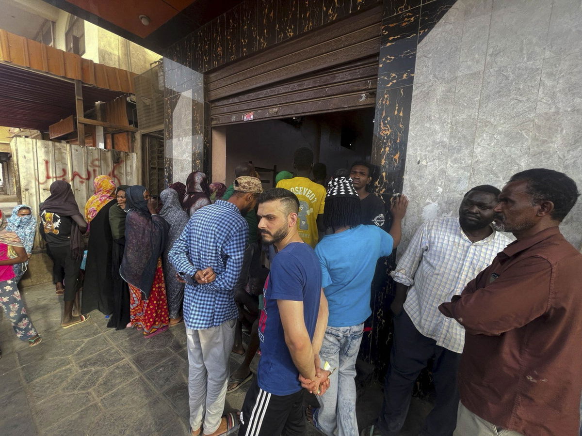 <i>El-Tayeb Siddig/Reuters</i><br/>A line to get bread in Sudan's capital on April 18.