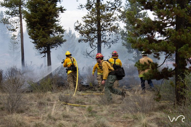 La Pine Fire District crew, assisted by Oregon Dept. of Forestry, stopped brush fire Wednesday near Bi-Mart, Senior Center