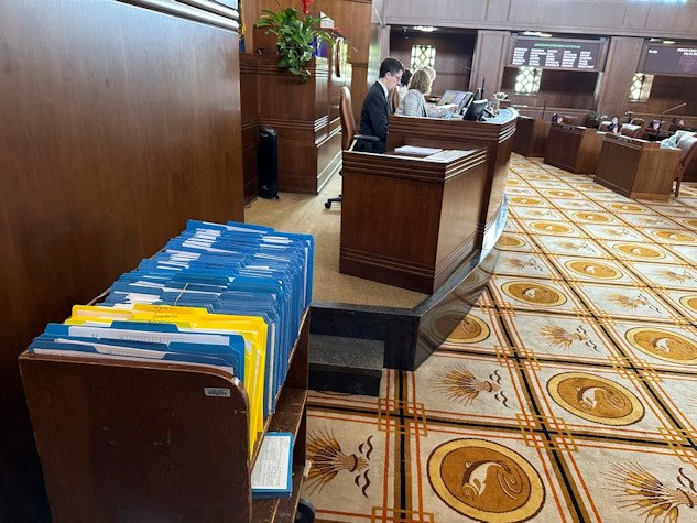 Hundreds of bills awaiting action in the Oregon Senate are held in a battered bookshelf on the Senate floor Tuesday, unable to move forward to a vote because of a continuing protest by Republicans