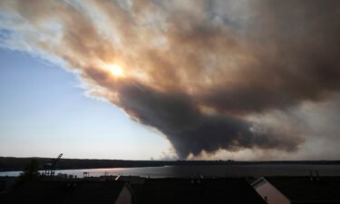 Thick plumes of heavy smoke fill the Halifax sky as an out-of-control fire in a suburban community quickly spread