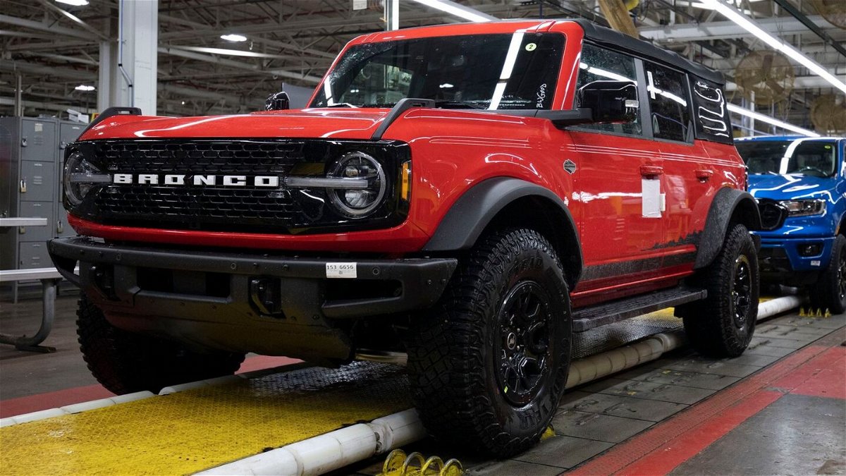 <i>Bill Pugliano/Getty Images</i><br/>A 2021 Ford Bronco (foreground) and a 2021 Ford Ranger (background) go through assembly at the Ford Michigan Assembly Plant on June 14