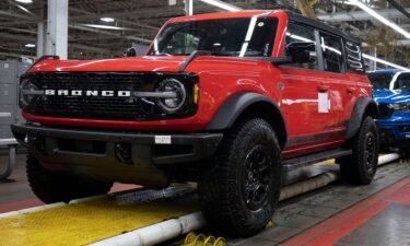 A 2021 Ford Bronco (foreground) and a 2021 Ford Ranger (background) go through assembly at the Ford Michigan Assembly Plant on June 14
