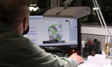 A 3D-model of a rough diamond is seen on a screen at the "Diamonds of Alrosa" factory in Moscow