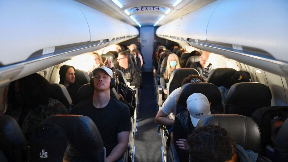 <i>Patrick T. Fallon/AFP/Getty Images</i><br/>Airline passengers sit during an American Airlines flight operated by SkyWest Airlines from Los Angeles International Airport (LAX) to Denver