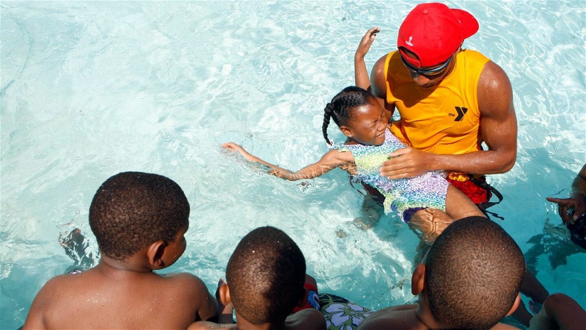 <i>Karen Pulfer Focht/The Commercial Appeal/AP</i><br/>Children get a swimming lesson at a YMCA in Memphis