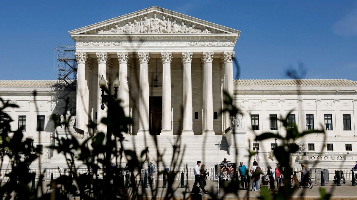 <i>Anna Moneymaker/Getty Images</i><br/>People visit the front of the U.S. Supreme Court Building on April 19