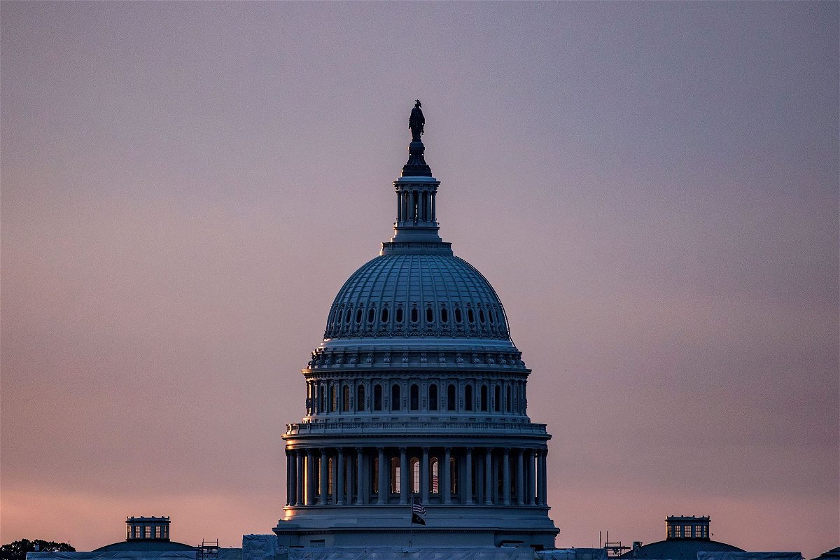 <i>Samuel Corum/AFP/Getty Images</i><br/>The US Capitol building is seen from the base of the Washington Monument as the sun rises in Washington