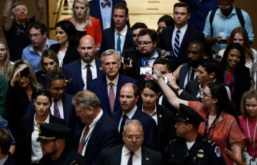 Speaker of the House Kevin McCarthy speaks to reporters as he walks through Statuary Hall in the U.S. Capitol Building on May 30 in Washington