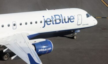 A JetBlue jet moves along the runway at Laguardia Airport in November 2022. American Airlines and JetBlue Airways have to break up their alliance on Northeast US flight routes