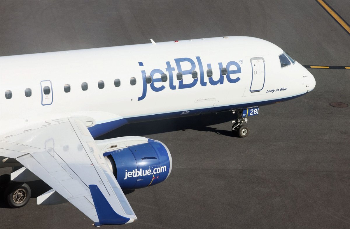 <i>Bruce Bennett/Getty Images</i><br/>A JetBlue jet moves along the runway at Laguardia Airport in November 2022. American Airlines and JetBlue Airways have to break up their alliance on Northeast US flight routes
