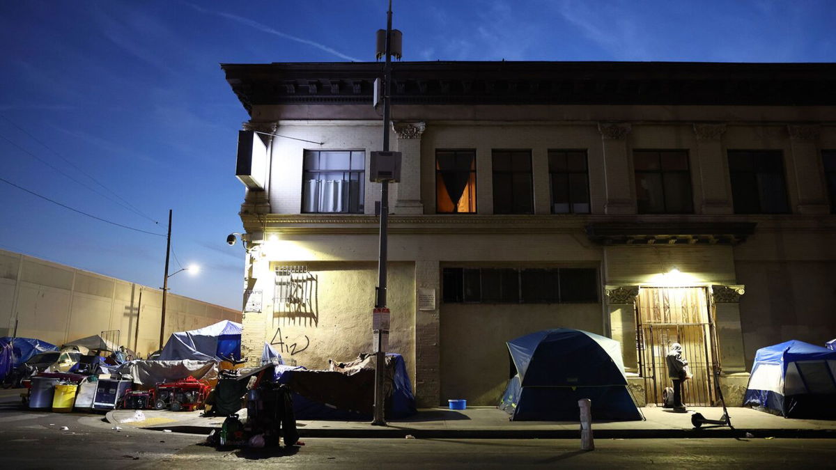 <i>Mario Tama/Getty Images/File</i><br/>The Biden administration Thursday announced new steps to help reduce homelessness. Pictured is an encampment for the homeless in 2022 in Los Angeles.