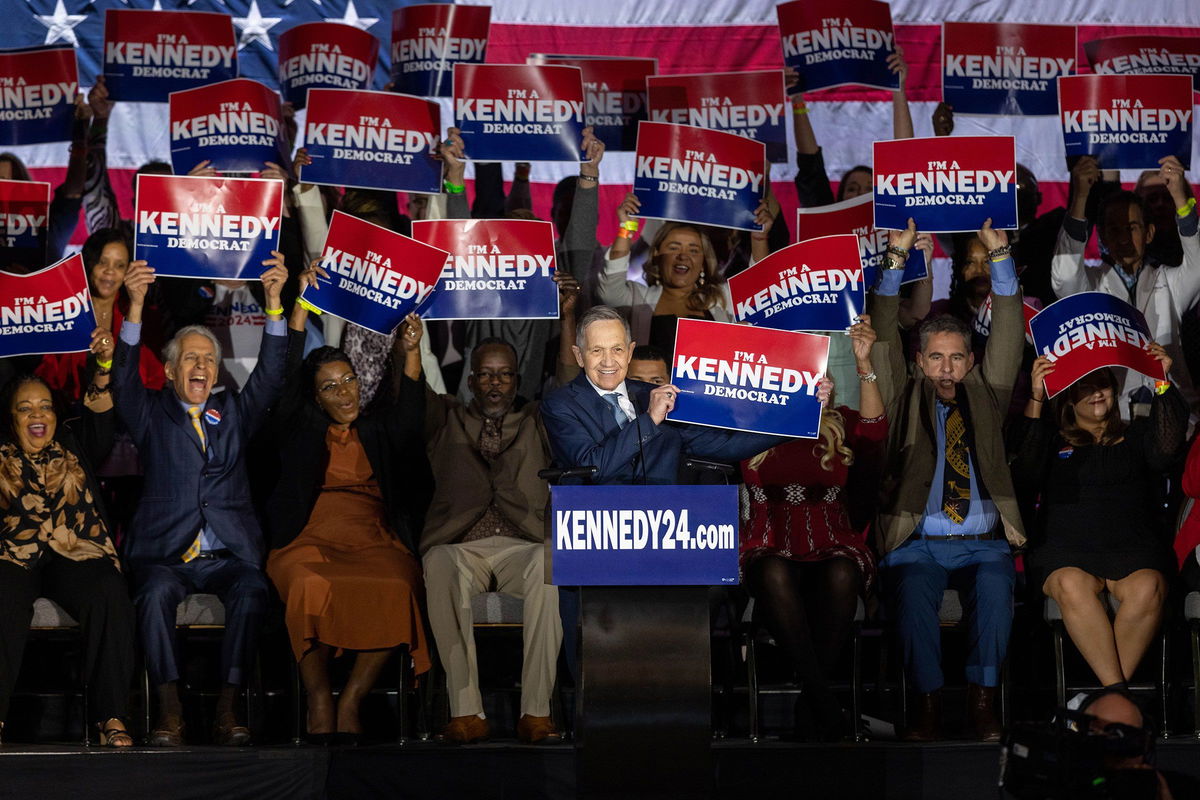 <i>Scott Eisen/Getty Images</i><br/>Former Ohio Rep. Dennis Kucinich introduces Robert F. Kennedy Jr. at his official presidential announcement in Boston on April 19. Kennedy has selected Kucinich as his campaign manager.