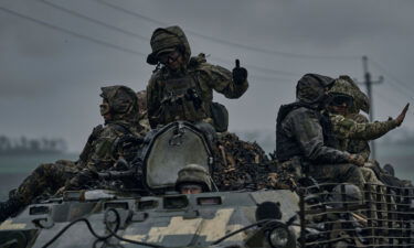 Ukrainian servicemen ride towards frontline positions near Vuhledar