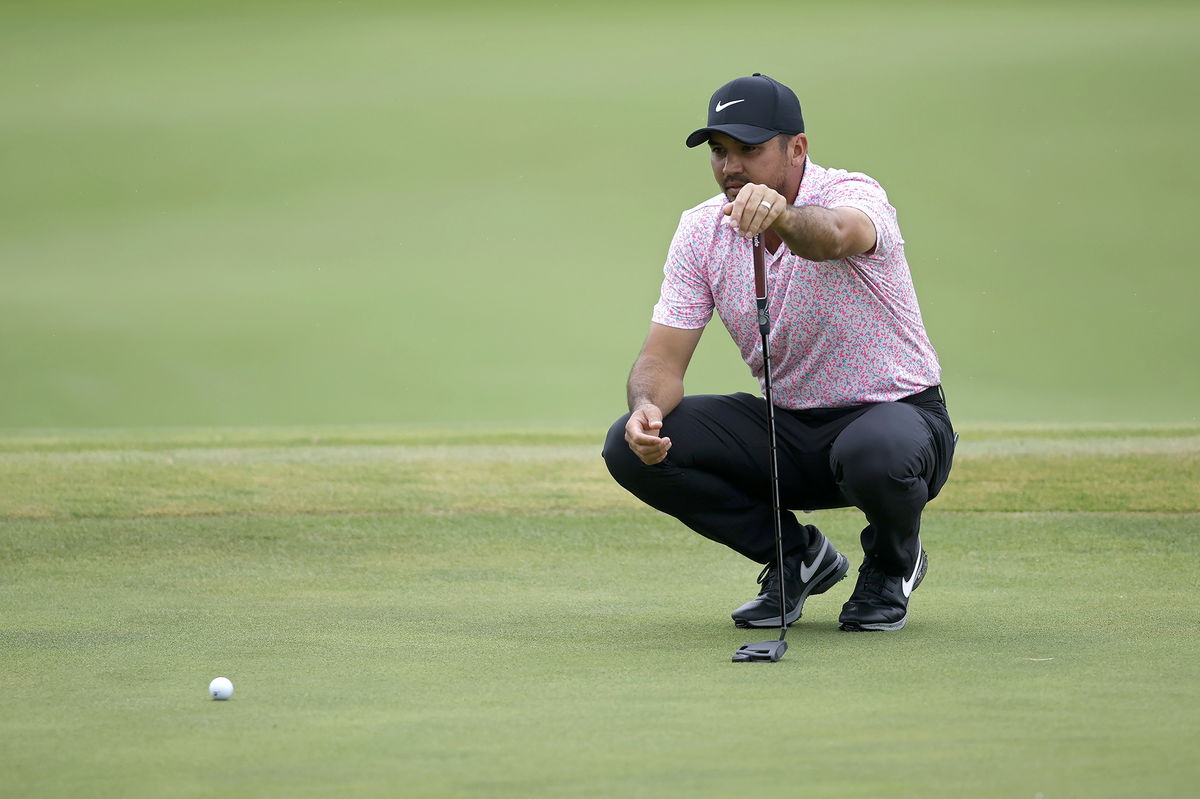 <i>Tim Heitman/Getty Images</i><br/>Day lines up a putt during his nine-under final round.