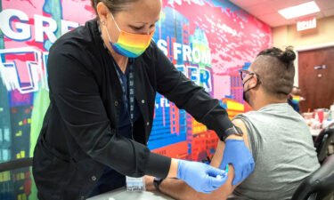 Nurse Kerri Phithibeault gives Danny Garcia an mpox vaccination in Orlando