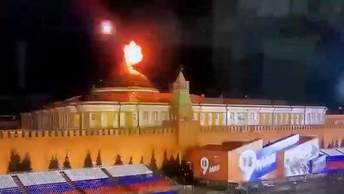 <i>Ostorozhno Novosti/Reuters</i><br/>The tight ring of security that surrounds the seat of the Russian presidency was punctured by what appeared to be two attempted drone strikes on May 3. A still image taken from video shows a flying object exploding near the dome of the Kremlin.